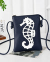 H436 SEAHORSE LASER CUT CROSSBODY BAG navy